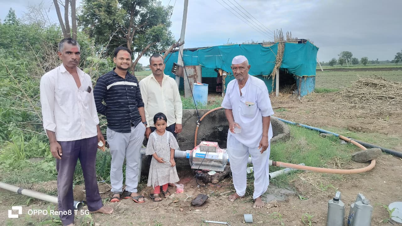 Rural farm installation with farmers, child, and water conditioning device in agricultural setting