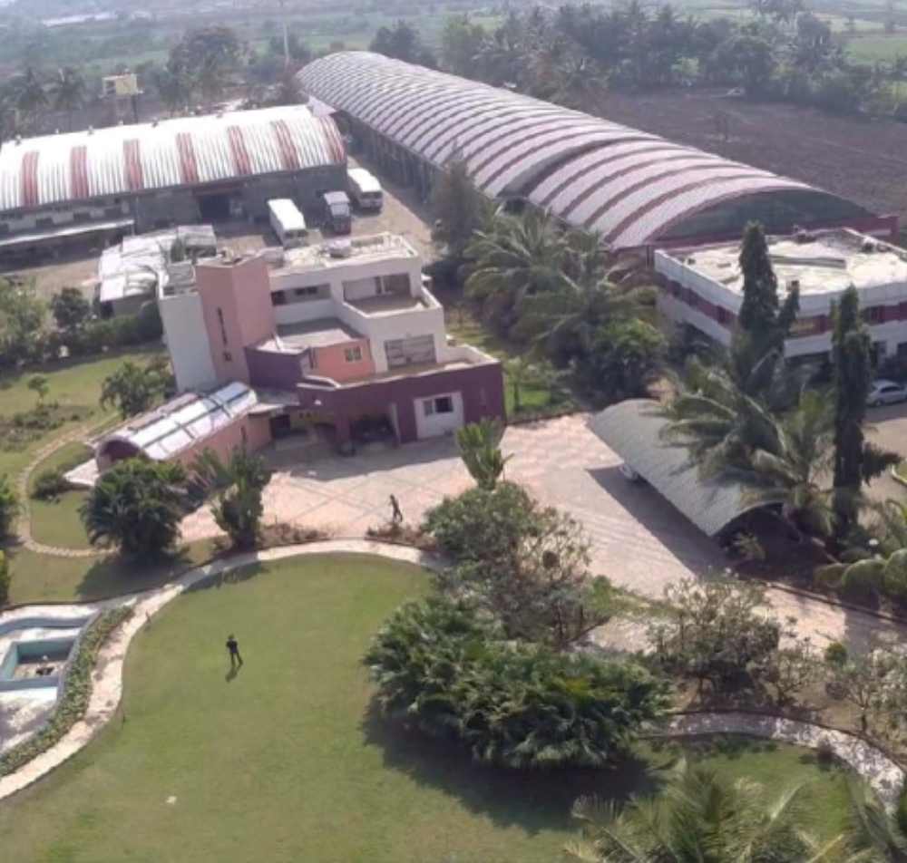 Mhetre Packaging Factory - Industrial manufacturing facility with curved-roof warehouses and production units